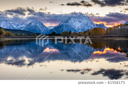 Mount Moran view from Oxbow Bend beside Snake River at sunset of Grand Teton, Wyoming. Mount Moran view from Oxbow Bend beside Snake River at sunset of Grand Teton, Wyoming. 61508173