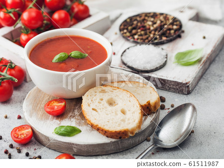 White bowl plate of creamy tomato soup with spoon White bowl plate of creamy tomato soup with spoon 61511987