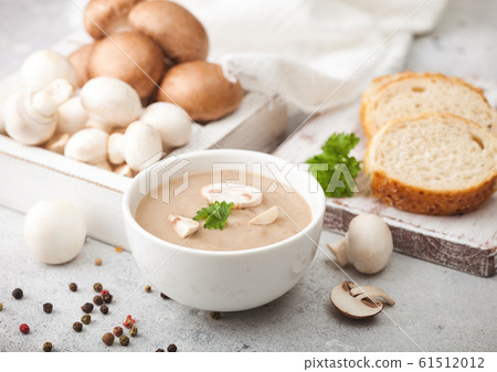 White bowl plate of creamy chestnut champignon White bowl plate of creamy chestnut champignon 61512012