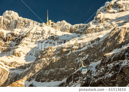 Gondola of the aerial tramway to the mountain Saentis in the Swiss Alps in winter, Switzerland 61513650