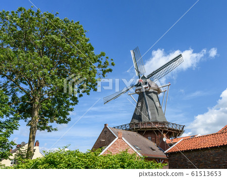 Windmill in the "Rundwarftendorf" Rysum, East Frisia, Lower Saxony, Germany Windmill in the "Rundwarftendorf" Rysum, East Frisia, Lower Saxony, Germany 61513653