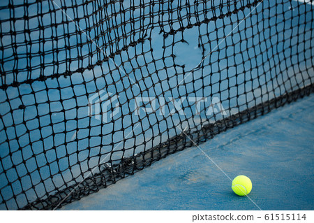 tennis ball on a tennis court 61515114