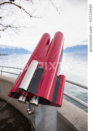 Red touristic telescope near Lake Geneva Red touristic telescope near Lake Geneva 61516484
