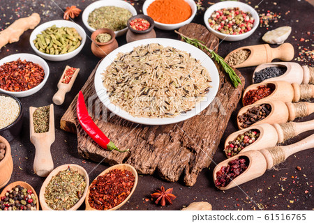 Spices and herbs over black stone background 61516765