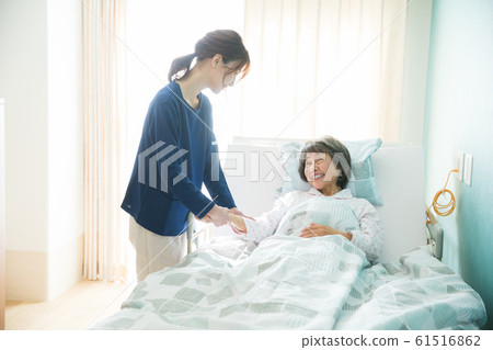 Senior woman and caregiver 61516862