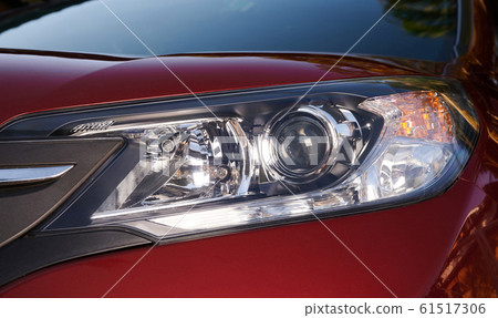 Close up of red car headlight Close up of red car headlight 61517306