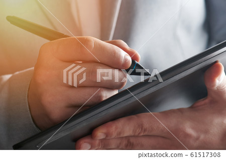 Touch pen in man hand Touch pen in man hand 61517308