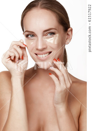 A beautiful young girl, after the shower, dresses A beautiful young girl, after the shower, dresses 61517922