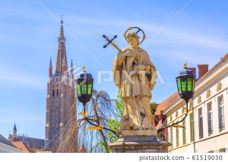 Bruges, Belgium cityscape with statue of Johannes Nepomucenus Bruges, Belgium cityscape with statue of Johannes Nepomucenus 61519030