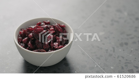 dried cranberry in white bowl on terrazzo countertop dried cranberry in white bowl on terrazzo countertop 61520686