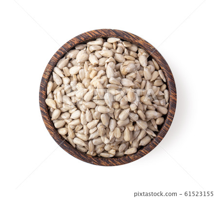 sunflower seeds in wood bowl isolated on white 61523155