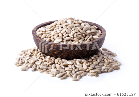 sunflower seeds in wood bowl isolated on white 61523157