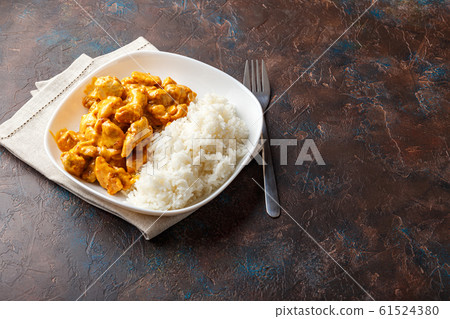 Curried Coconut Chicken with rise Curried Coconut Chicken with rise 61524380