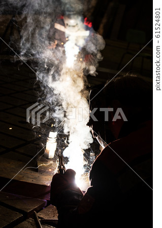worker welds metal structures by electric arc worker welds metal structures by electric arc 61524801
