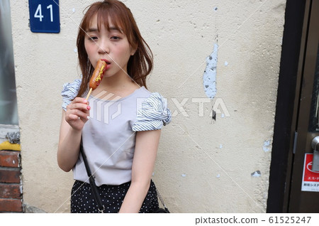 A street photo of a beautiful girl walking along the Tokyo Sumida River A street photo of a beautiful girl walking along the Tokyo Sumida River 61525247