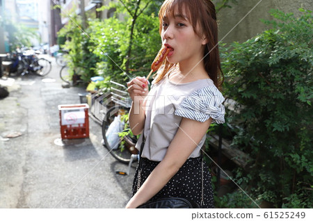 A street photo of a beautiful girl walking along the Tokyo Sumida River A street photo of a beautiful girl walking along the Tokyo Sumida River 61525249