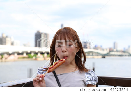 A street photo of a beautiful girl walking along the Tokyo Sumida River A street photo of a beautiful girl walking along the Tokyo Sumida River 61525254