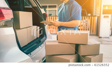 hai mailman checking parcel and mail boxes for 61526352