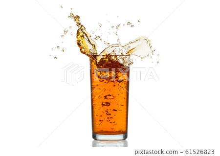 Glass of splashing drink. 61526823
