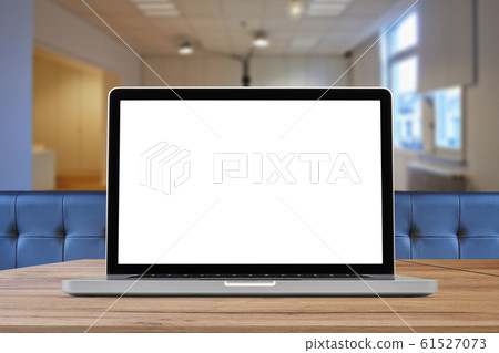Laptop on wooden desk against office background Laptop on wooden desk against office background 61527073