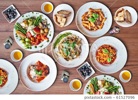 Some Plates of Delicious italian food on Textured Some Plates of Delicious italian food on Textured 61527096