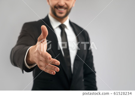 Businessman giving hand for shake. Businessman giving hand for shake. 61528234