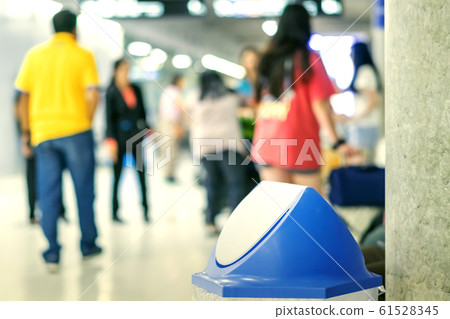 Blue cover transparent trashcan for increasing safety measures placed on the floor in the airport. 61528345
