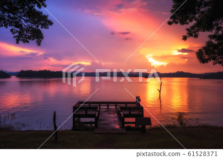 Couple at Pom pee viewpoint at sunset 61528371