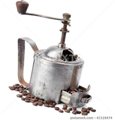 Manual coffee mill on roasted coffee beans Manual coffee mill on roasted coffee beans 61528474