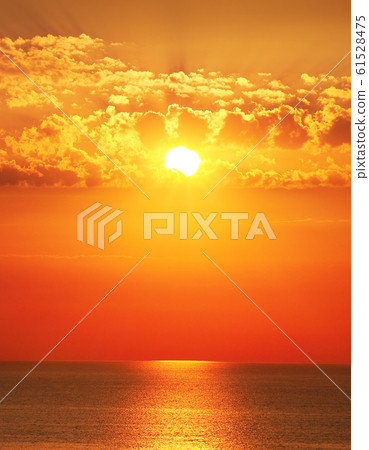 Bright sun rise over the sea. Bright sun rise over the sea. 61528475
