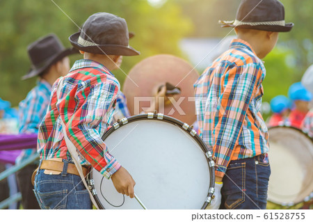 Marching band bass drummers perform in school parade Marching band bass drummers perform in school parade 61528755
