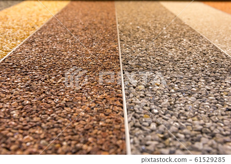 Close up of a natural stone carpet. Decorative stone coating. Slip resistant floor finish containing natural stone particles. Set of various types and colors. Close up of a natural stone carpet. Decorative stone coating. Slip resistant floor finish containing natural stone particles. Set of various types and colors. 61529285