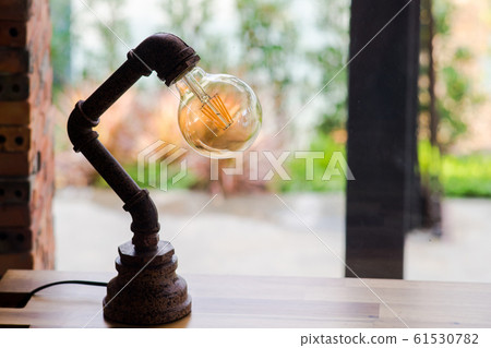 Antique lamp on table Antique lamp on table 61530782