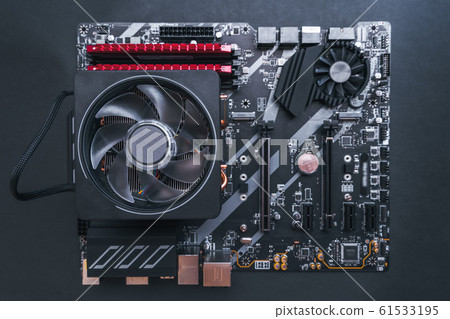PC components. Motherboard with CPU Fan and memory DRAM modules.DDR4. Modern Motherboard. Transistors. Gaming PC. PC components. Motherboard with CPU Fan and memory DRAM modules.DDR4. Modern Motherboard. Transistors. Gaming PC. 61533195