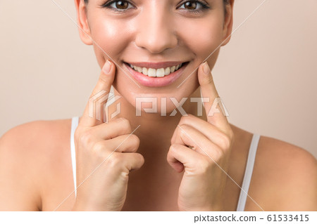 close up of a young woman beautiful smile, healthy lips and white teeth in high resolution close up of a young woman beautiful smile, healthy lips and white teeth in high resolution 61533415