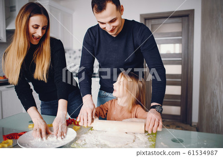 Family cook the dough for cookies Family cook the dough for cookies 61534987