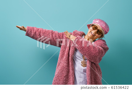 senior woman on color background. senior woman on color background. 61536422