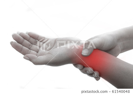The woman holds on to the sore wrist at white background The woman holds on to the sore wrist at white background 61540048