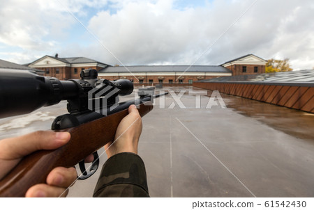 POV of male hands shooting with air rifle 61542430