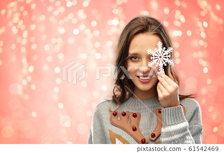 woman in christmas sweater with snowflake woman in christmas sweater with snowflake 61542469