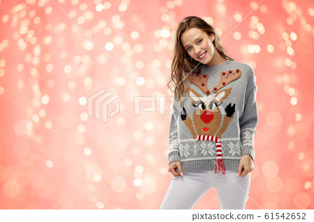 woman in christmas sweater with reindeer pattern woman in christmas sweater with reindeer pattern 61542652