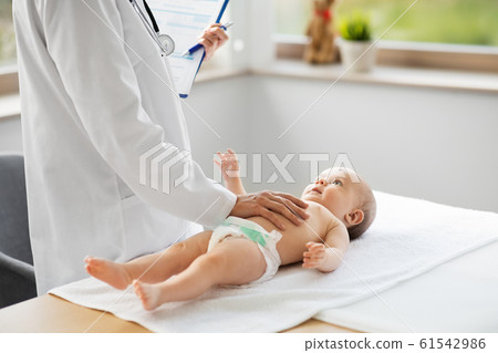 female pediatrician doctor with baby at clinic female pediatrician doctor with baby at clinic 61542986