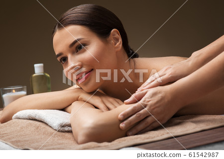woman lying and having massage at spa woman lying and having massage at spa 61542987
