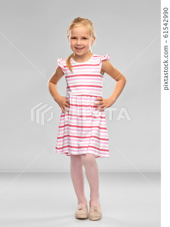 smiling little girl in striped dress smiling little girl in striped dress 61542990