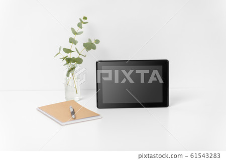 tablet pc with black screen on white office table tablet pc with black screen on white office table 61543283
