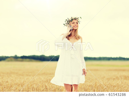 happy young woman calling on smartphone at country happy young woman calling on smartphone at country 61543286