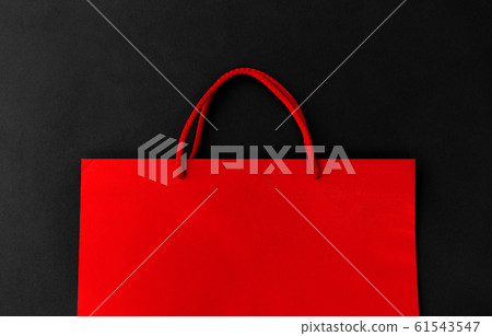 red shopping bag on black background 61543547