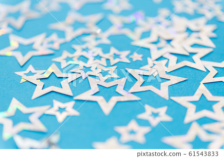 star shaped confetti decoration on blue background star shaped confetti decoration on blue background 61543833