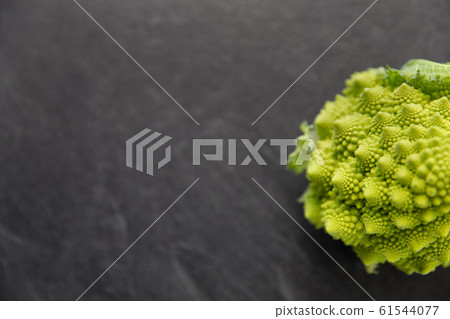 close up of romanesco broccoli on slate stone 61544077