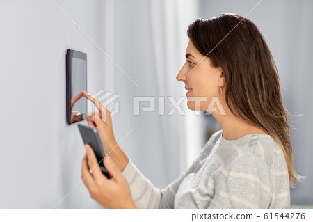 woman using tablet computer and smartphone woman using tablet computer and smartphone 61544276